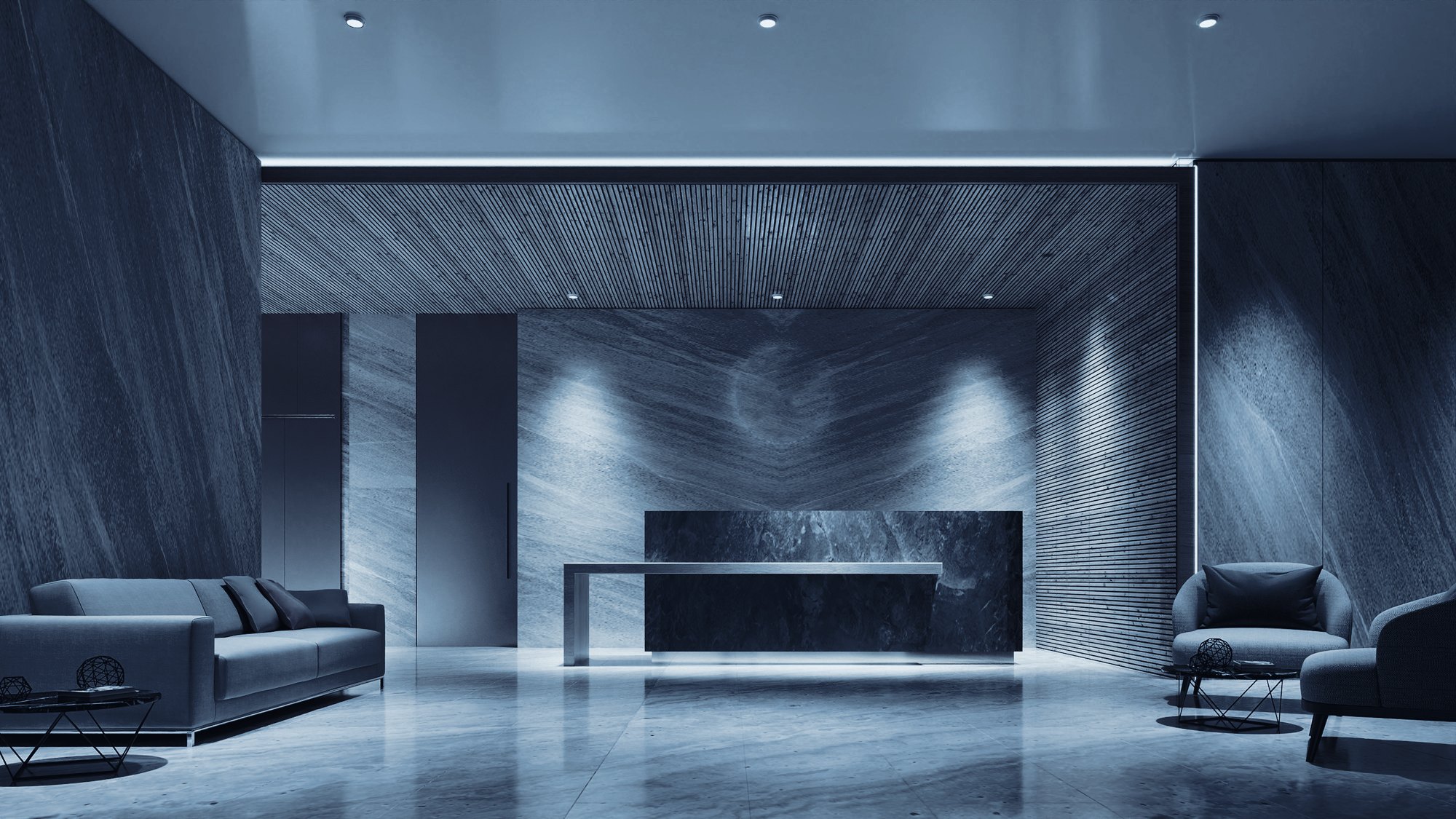 A quiet office lobby with a stone reception desk